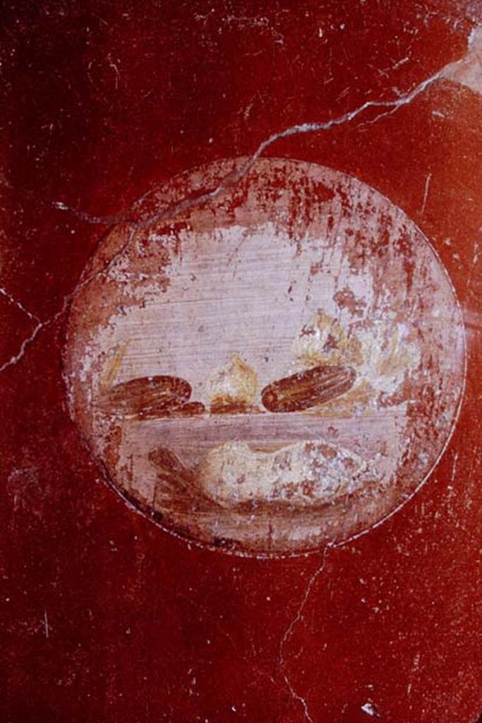 VI.16.15 Pompeii. 1968. Medallion on north end of east wall of room F. In the middle of the medallion, dates and figs are possibly seen, while below could be a white plucked chicken.
Photo by Stanley A. Jashemski.
Source: The Wilhelmina and Stanley A. Jashemski archive in the University of Maryland Library, Special Collections (See collection page) and made available under the Creative Commons Attribution-Non Commercial License v.4. See Licence and use details.
J68f0257