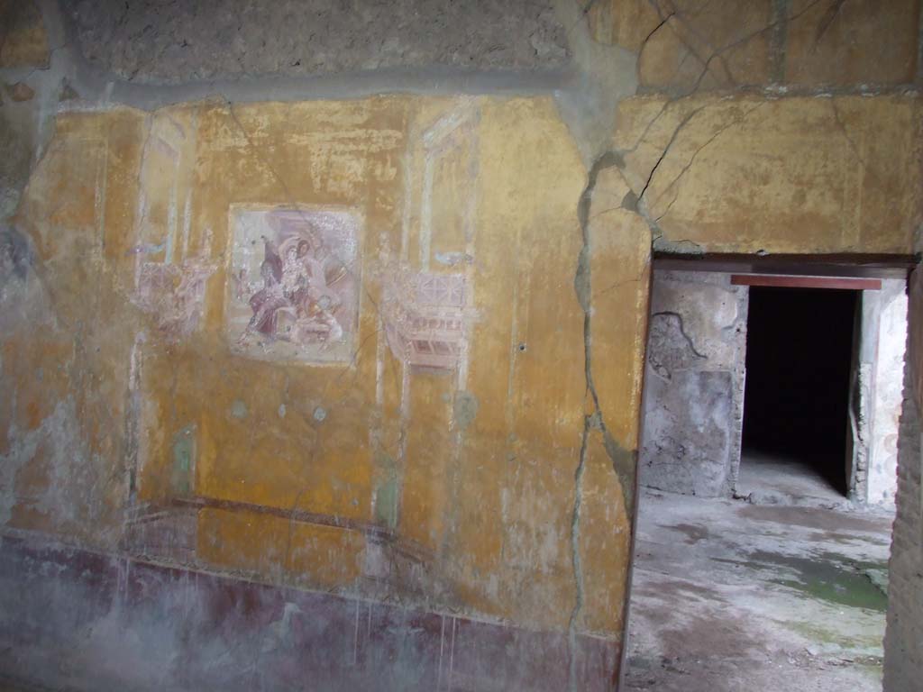 VI.16.15 Pompeii. December 2006. Doorway and north wall of room G.   
According to NdS, the yellow-painted walls each had three panels, with a frieze that was also yellow. The lower dado was painted red.
At the top of each wall was a cornice of painted stucco. In the middle of each central panel was a painting.