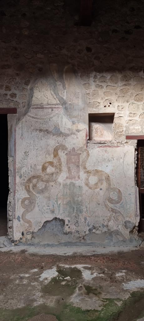 VI.16.15 Pompeii. December 2023.
Lararium on north wall of atrium. Photo courtesy of Miriam Colomer.