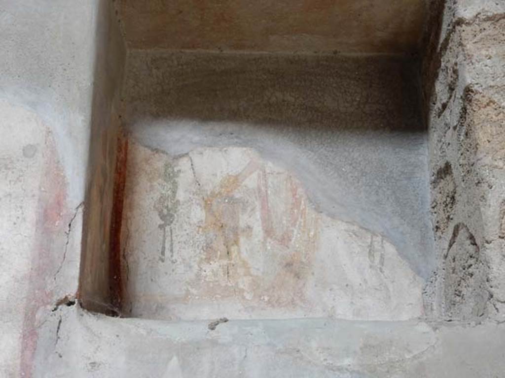 VI.16.15 Pompeii. May 2015. Niche of lararium on north wall of atrium, with remains of painting. Photo courtesy of Buzz Ferebee.