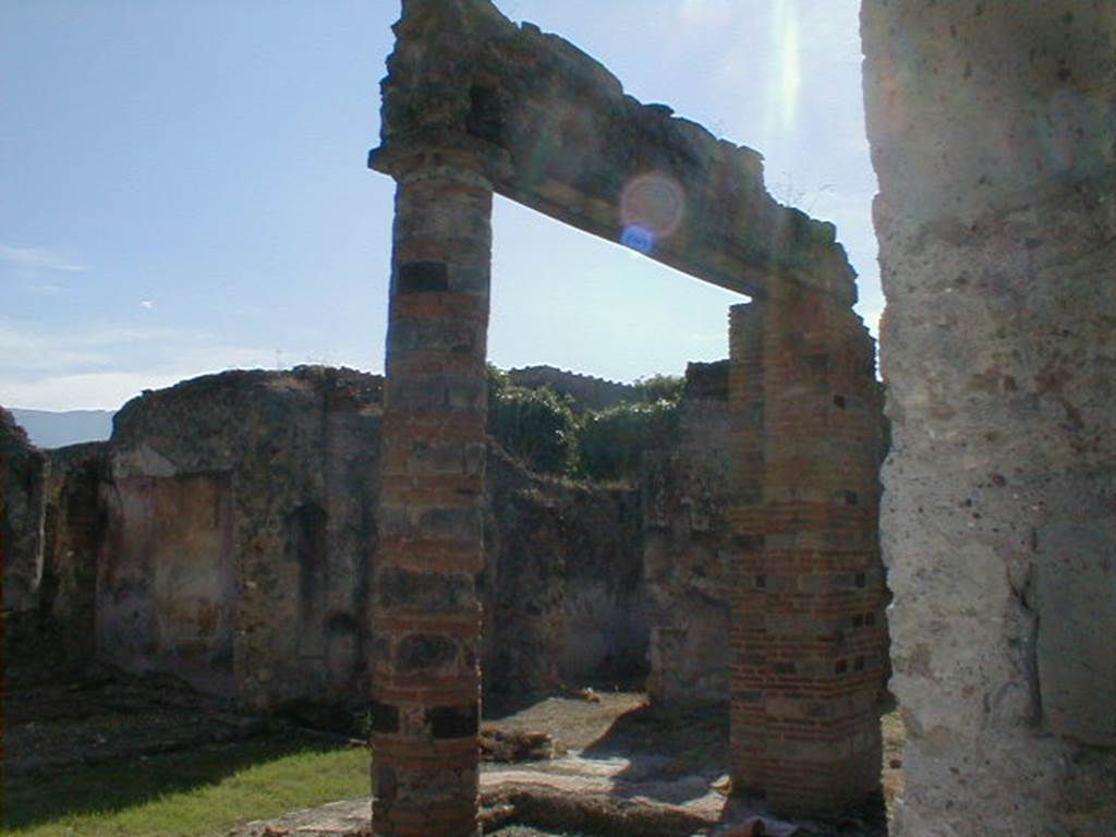 VI.16.19 Pompeii. September 2004. Looking across atrium and impluvium of VI.16.26/27 towards south-west corner.