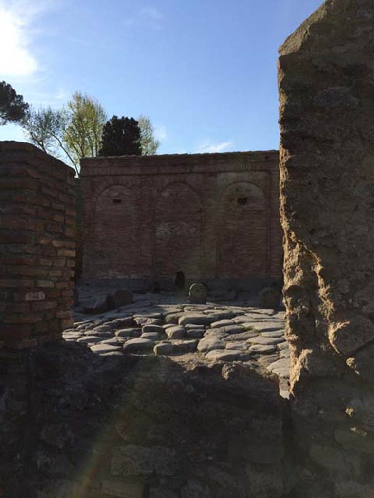 VI.16.23 Pompeii. April 2015. Looking north through window/bricked up small doorway? towards Castellum Aquae. Photo courtesy of Sharon M. Wolf.
