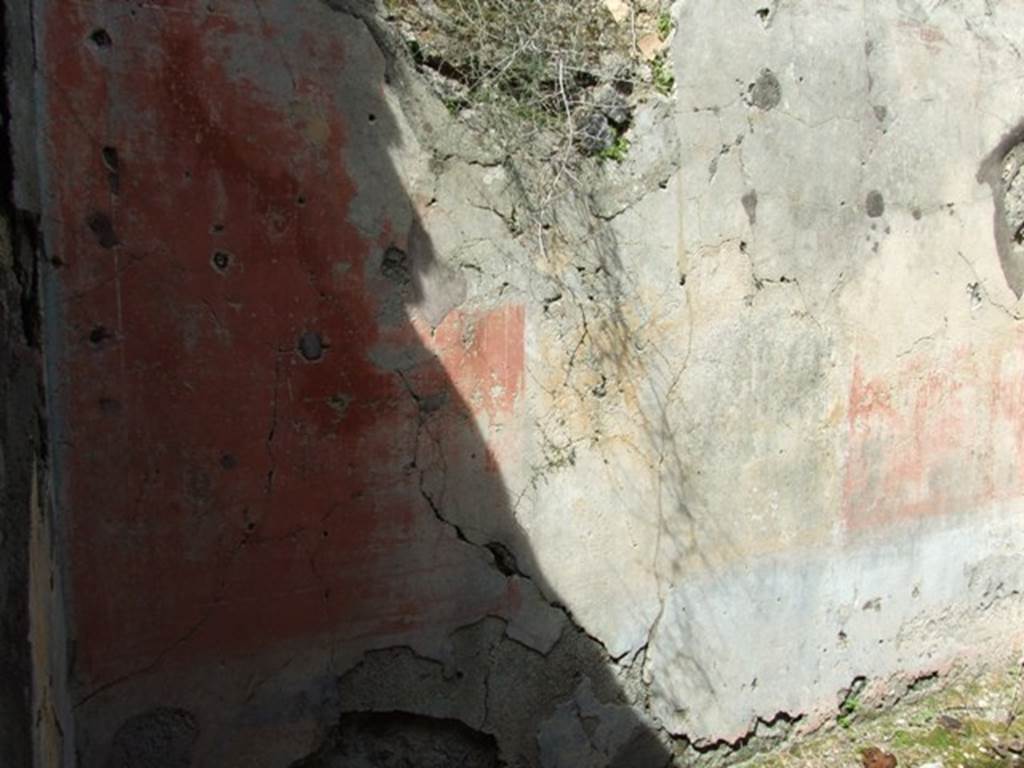 VI.16.28 Pompeii. March 2009. Room H, north wall. According to NdS, the decoration on this wall was the best preserved. The principle space was occupied by three major panels, yellow in the centre, with red on either side. There was no central painting exhibited in the middle. The frieze rather faded carried also panels of various colours, and the dado had a blackish background. In the height of the north wall was a bull’s eye partly walled by the ancients. See Notizie degli Scavi di Antichità, 1908, (p.278-9)