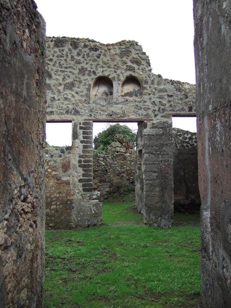 VI.16.32 Pompeii. December 2005. Looking east across room B, atrium. 
According to NdS, this atrium only contained a hint of an impluvium (a), being reduced to a simple and slight rectangular hole.
The border was adorned with a wide band with white tesserae buried in the mortar of the floor and containing pieces of encrusted marble.