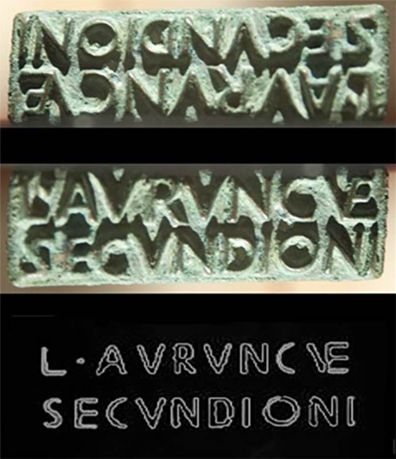 VI.16.32/33 Pompeii. Found 14th June 1904. Bronze sigillo or stamp of L. Aurunculeius Secundio. 
Top is the face of the seal. 
Centre is the reversed image.
Bottom is a drawing showing the outline of the stamp produced by the seal.
Composite photo courtesy of Dan Pater. SAP inventory number 55814.