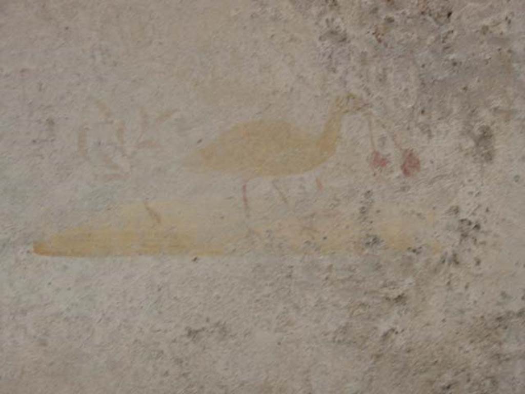 VI.16.33 Pompeii. May 2003. Painting of bird with two cherries in its beak, from centre of north wall. Photo courtesy of Nicolas Monteix.