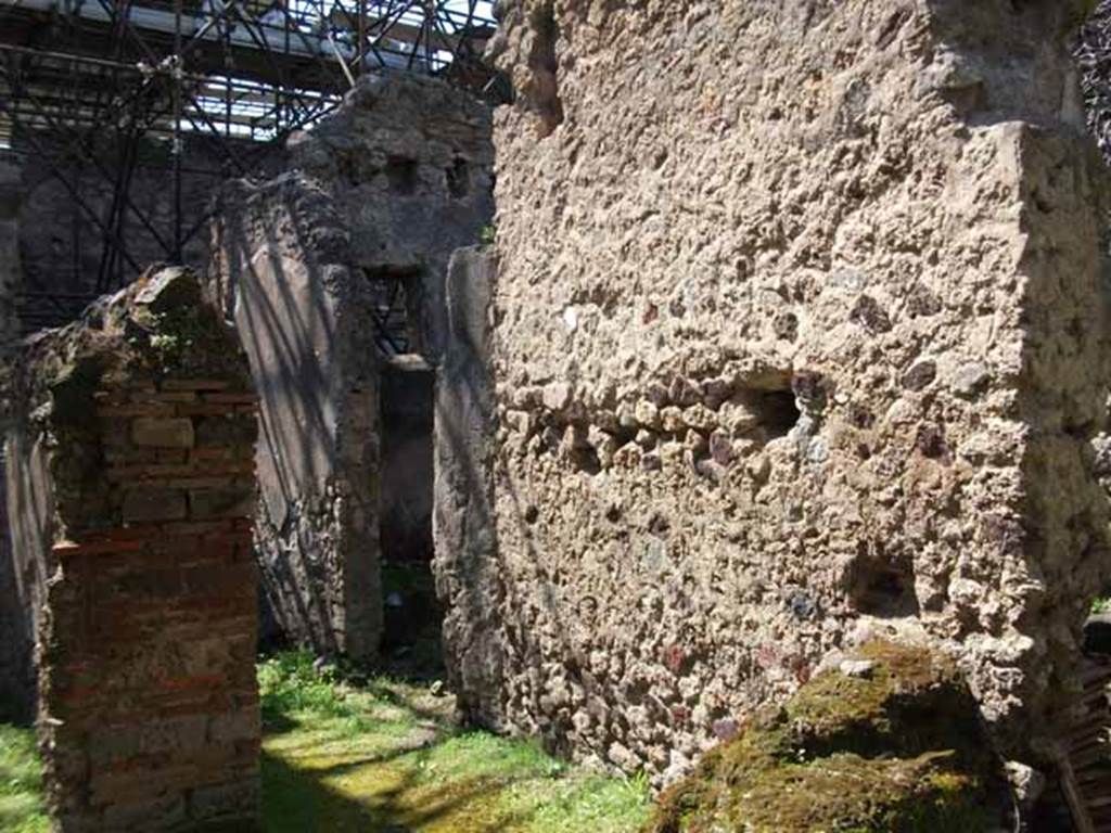 VI.16.7 Pompeii. May 2010. Looking west along corridor leading to rear entrance, with doorway to rear room.