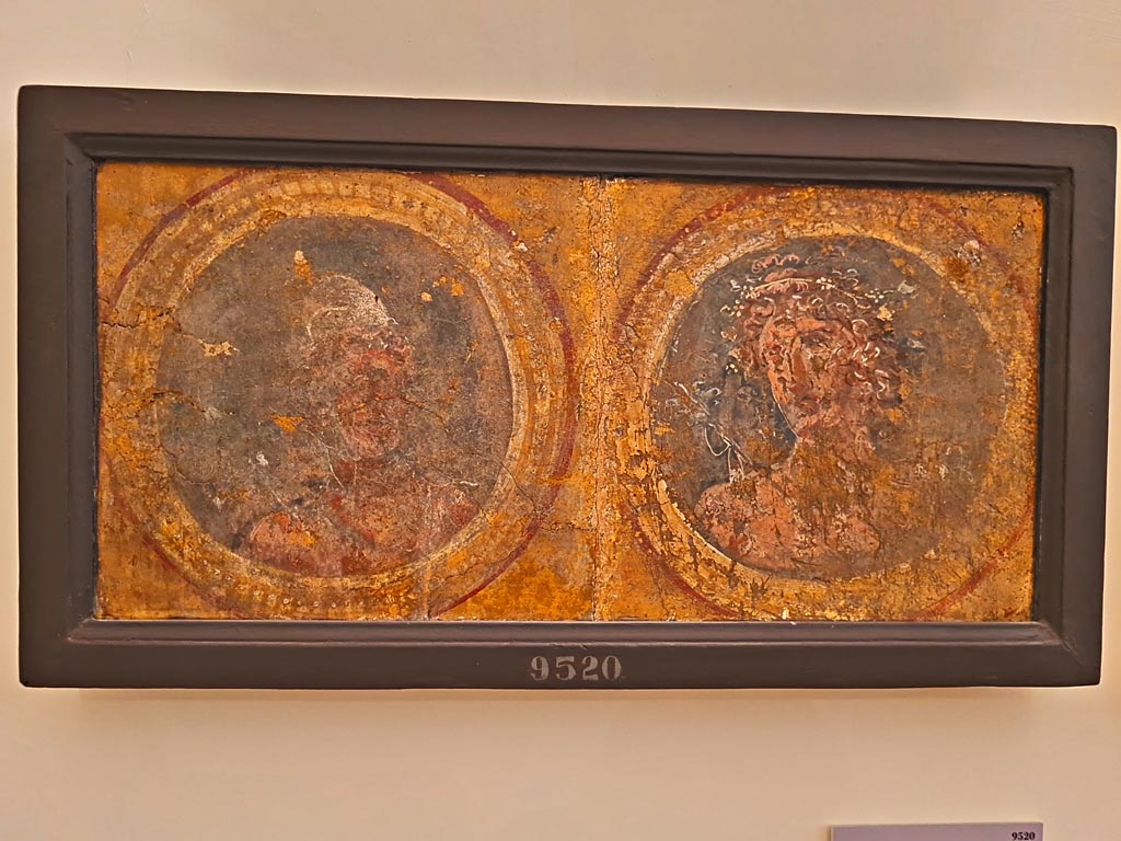 Pompeii Insula Occidentalis. October 2023. 
Two medallions with personification of deities and months, Vulcan (September) on left, and Bacchus (October), on right. 
Photo courtesy of Giuseppe Ciaramella. 
On display in “L’altra MANN” exhibition, October 2023, at Naples Archaeological Museum.