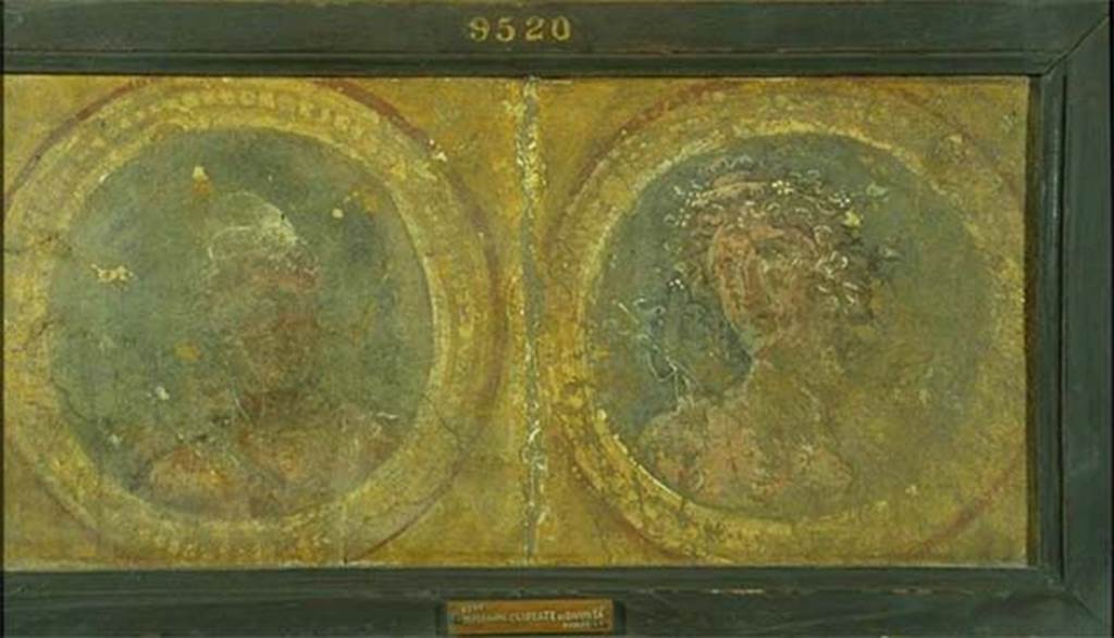 Pompeii Insula Occidentalis. Calendar of seasons made of two medallions, found beneath the Cuomo property. 
On the left, Vulcan in Phrygian cap (September) and on the right, Dionysus with crown of ivy (October).
Now in Naples Archaeological Museum. Inventory number 9520.
According to Grasso, these two separate medallions have been inserted into one picture-frame.
See Bragantini, I & Sampaolo, V (eds). 2009. La Pittura Pompeiana, (Electa), (p. 533)
According to Pagano and Prisciandaro, this was found 26th April - 2nd May 1760, in the same room as 9518, 9519 and 9521. (PAH, 1, 106)
See Pagano, M. and Prisciandaro, R., 2006. Studio sulle provenienze degli oggetti rinvenuti negli scavi borbonici del regno di Napoli.  Naples: Nicola Longobardi. (p. 33)