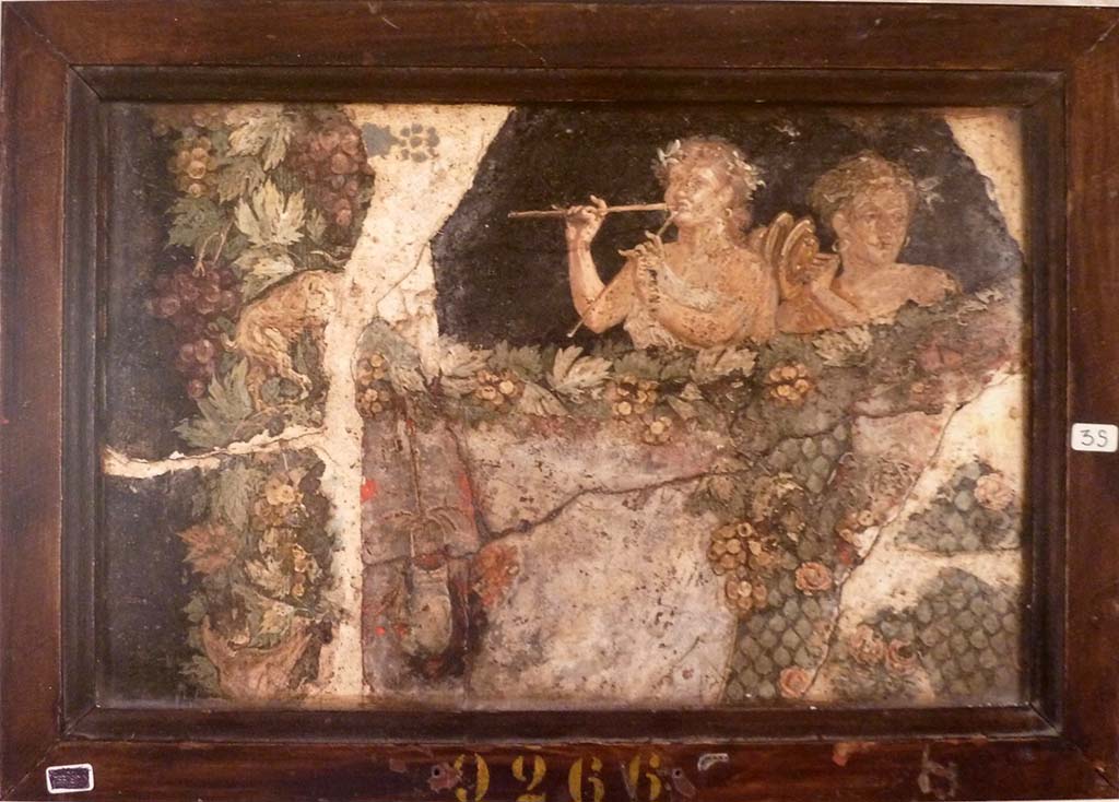Pompeii Insula Occidentalis. Above a garland of grapes are the busts of two Bacchantes. 
One is dressed in white and is playing a double flute. 
The other is dressed in yellow and is playing the cymbals.
Now in Naples Archaeological Museum. Inventory number 9266.
See Helbig, W., 1868. Wandgemälde der vom Vesuv verschütteten Städte Campaniens. Leipzig: Breitkopf und Härtel, 461.