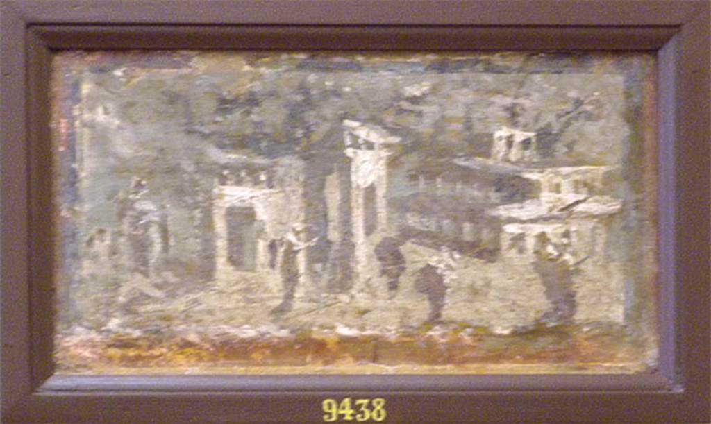 Irace property Pompeii. Architectural landscape.
Now in Naples Archaeological Museum. Inventory number 9438.
According to Pagano & Prisciandaro, found 12/7/1760, with another 3 paintings all with blue backgrounds, (9151, 9465, 9436)
(probably from under the Irace property, as were listed with the others from there).
See Pagano, M. and Prisciandaro, R., 2006. Studio sulle provenienze degli oggetti rinvenuti negli scavi borbonici del regno di Napoli.  Naples: Nicola Longobardi. (p. 34-5)
According to Spinazzola these were from IX.12.4 and found around 1912.
See Spinazzola V., 1953. Pompei alla luce degli Scavi Nuovi di Via dell’Abbondanza (anni 1910-1923). Roma: La Libreria della Stato, Vol.2, p.719, fig.690.