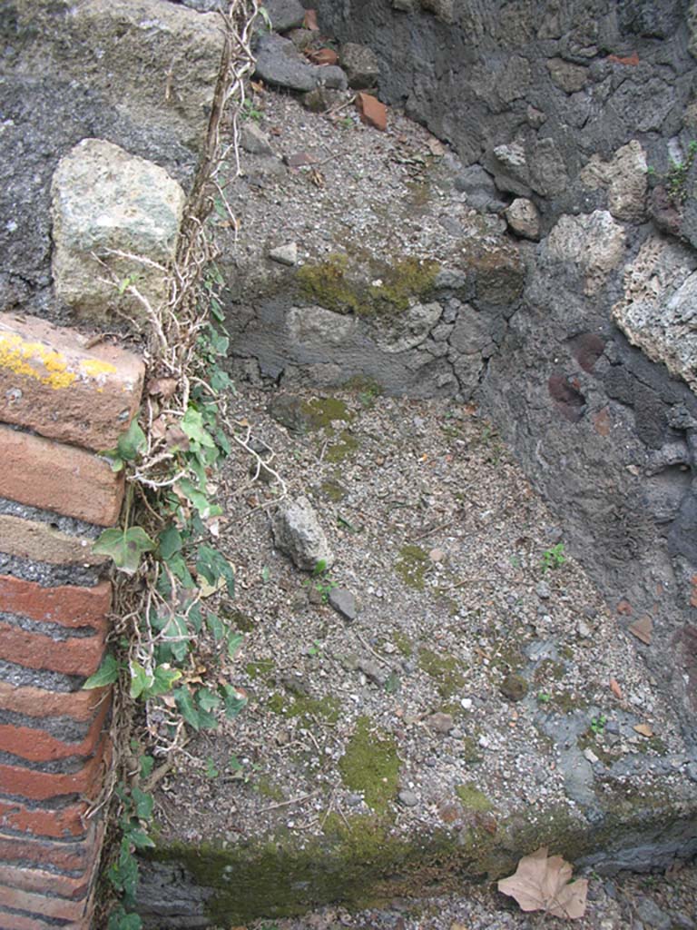 VI.17.1 Pompeii. May 2010. 
Looking north-east into small room, latrine or corridor on north side of hearth. Photo courtesy of Ivo van der Graaff.