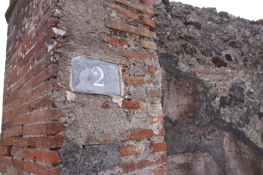 VI.17.2 Pompeii. September 2021. 
Looking towards pilaster on south side of entrance doorway, with painted decoration on south wall. Photo courtesy of Klaus Heese.