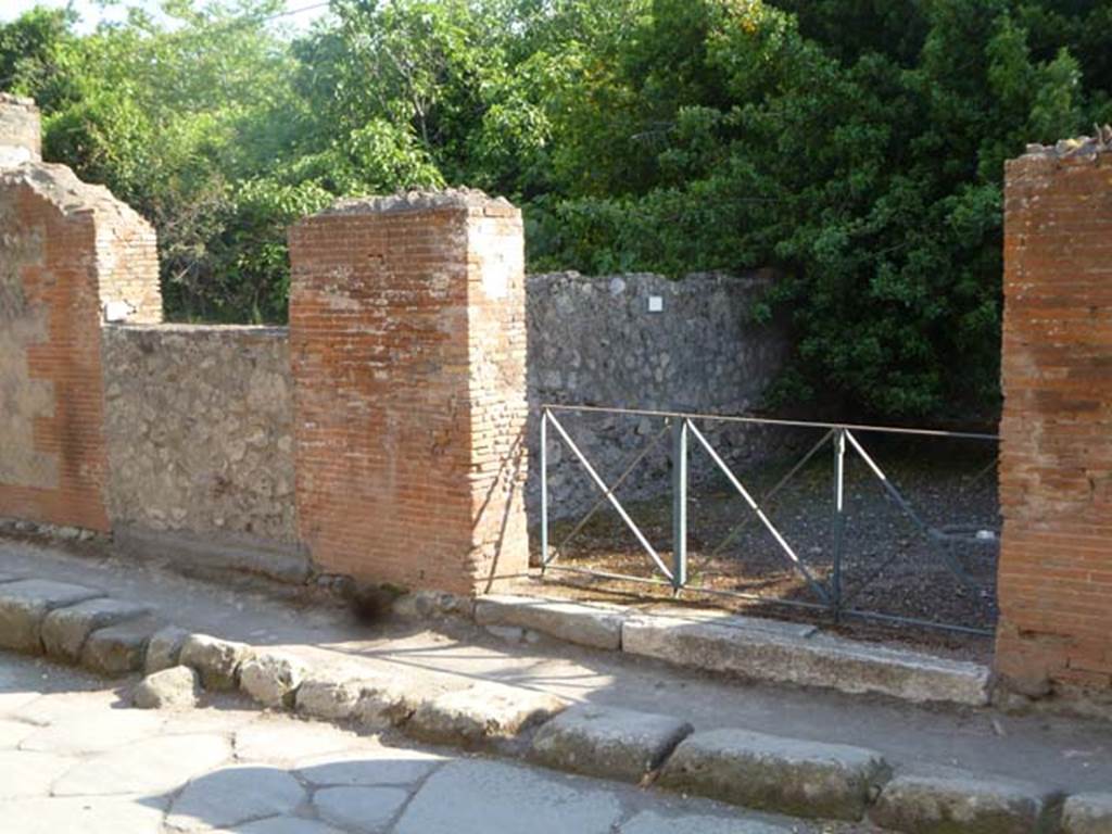 VI.17.9 on left, and VI.17.8 on right, Pompeii. May 2011. Looking towards entrance doorways on Via Consolare. Photo courtesy of Michael Binns.
