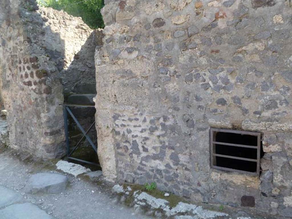 VI.17.12 Pompeii. May 2011. Looking south-west towards doorway to steps. On the right can be seen an opening giving a view of the cellar, on a lower level. Photo courtesy of Michael Binns.