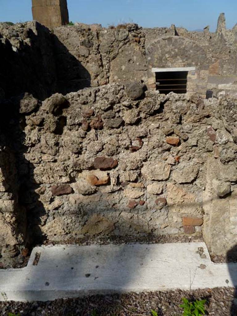 VI.17.17 Pompeii. May 2011. South-east corner of atrium, looking east into a blocked doorway, with the remains of its threshold. This doorway would have connected with VI.17.18.