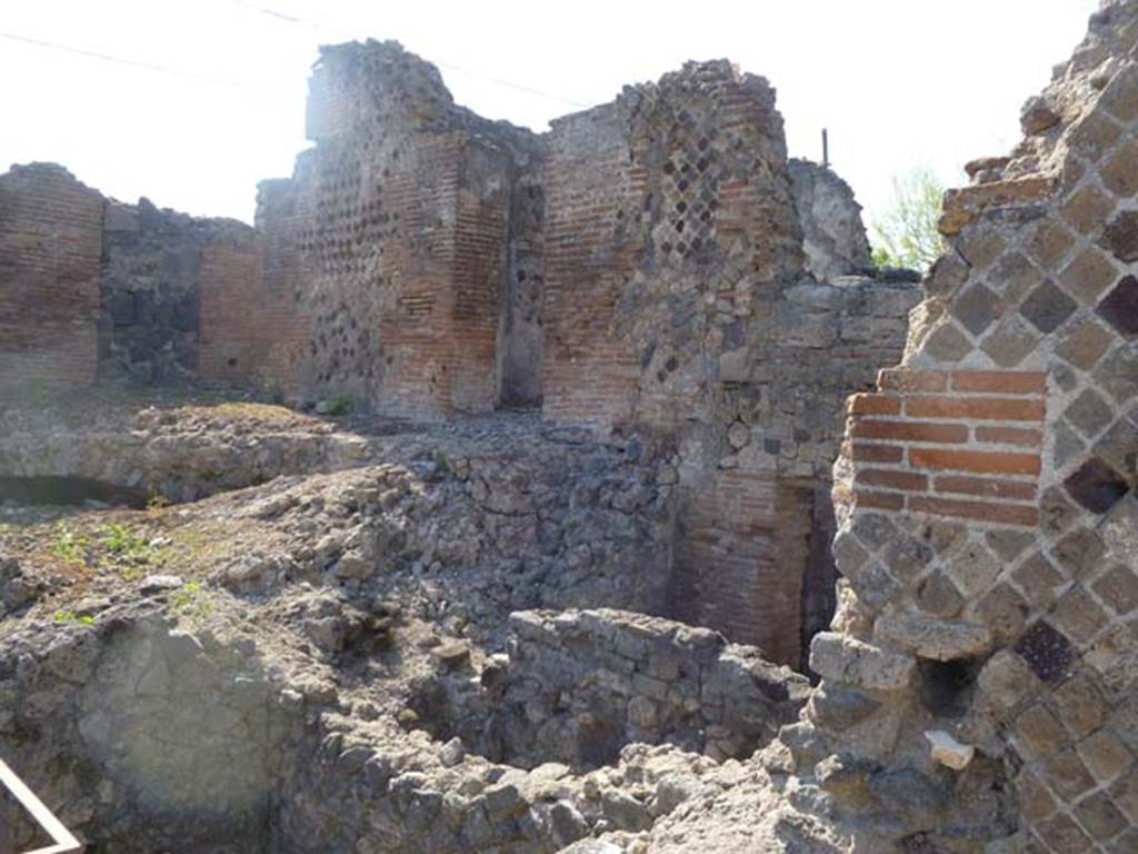 VI.17.36 Pompeii. May 2011. North side, with both upper and lower levels. Photo courtesy of Michael Binns. Possibly the upper level on the right of this photo may have been the area as described in PAH, 1, 3, (p.4)  “1-18th Maggio 1808 – Il giorno 15 del corrente venne il Re a Pompei, ed in sua presenza si scavarono due stanze e due botteghe appartenenti alla casa di Polibio. In una di queste stanze la fabbrica era alquanto diroccata, ed il pavimento in musaico bianco e nero, con un quadro nel mezzo di musaico colorito rappresentante la figura di Atteone; detto quadro era di circa palmi due in quadro. Nell’altre stanze le pareti sono tutte dipinte con varii arabeschi, e vi sono due quadri, uno con figura di uomo sedente con puttino, l’altro con due figure sedenti una di uomo a l’altra di donna con puttino.  Detti quadri sono di palmi 1 and three-quarters in quadro. In questa stanza e nelle due botteghe si era trovato quanto segue –”
(translation – "1-18th May 1808 –  On the 15th day of the current month the King came to Pompeii, and in his presence they dug two rooms and two shops belonging to the House of Polybius. In one of these rooms the structure was somewhat dilapidated, and the floor in black and white mosaic, with a picture in the middle of colorful mosaic representing the figure of Actaeon; this picture was approximately 0.53m square).  In the other rooms the walls were all painted with various arabesques, and there were two paintings, one with a figure of a sitting man with a small cherub, (NAP inv. no: 9382, Helbig 1357), the other with two sitting figures, a man and a woman, with a small cherub.  These paintings are approximately 0.46m square. In this room and in the two shops, the following were found, (see list p.4-6) –”
“28 Maggio 1808 – Nella casa detta di Polibio a Pompei si sono terminate di ricercare, la stanza che resta alla destra dell’ingresso, e le due botteghe della stessa abitazions, che s’incominciarono a frugare il di 15 di questo mese………………...  Quello che si trovo……..., e quell’altro poco che in seguito si era rinvenuto, era il seguente – Argento……(p4-6 elenco). (translation: “28th May 1808 –  In the house called of Polybius in Pompeii, they had finished searching, the room that is to the right of the entrance, and the two shops in the same dwelling, which they had begun to search on the 15th of this month……………….  The items found, ………… and those others found later, were as follows – Silver............ (p4-6 list)”