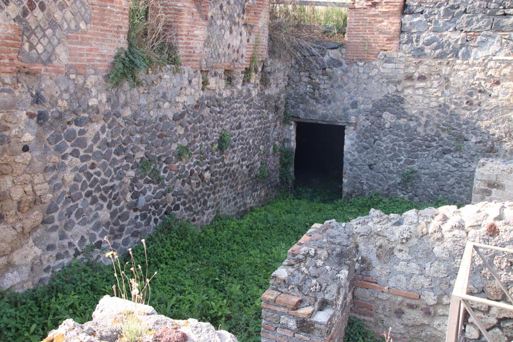 VI.17.37 Pompeii. October 2023.
Looking west along south wall towards doorway in south-west corner into lower room. Photo courtesy of Klaus Heese.