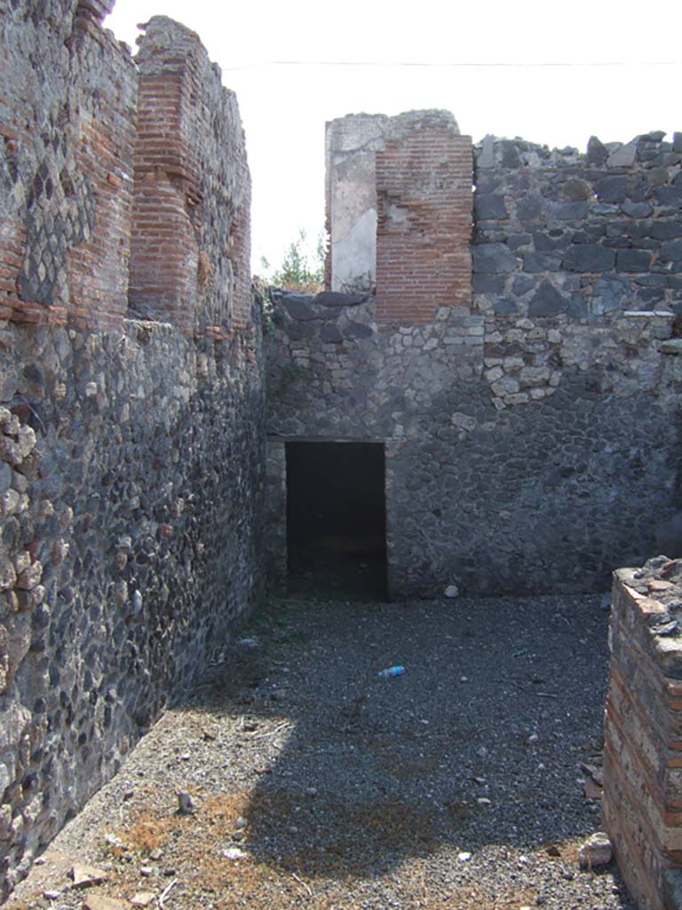 VI.17.37 Pompeii. September 2005. Looking west to doorway to atrium, on upper level.
Doorway to underground room, on lower level.
