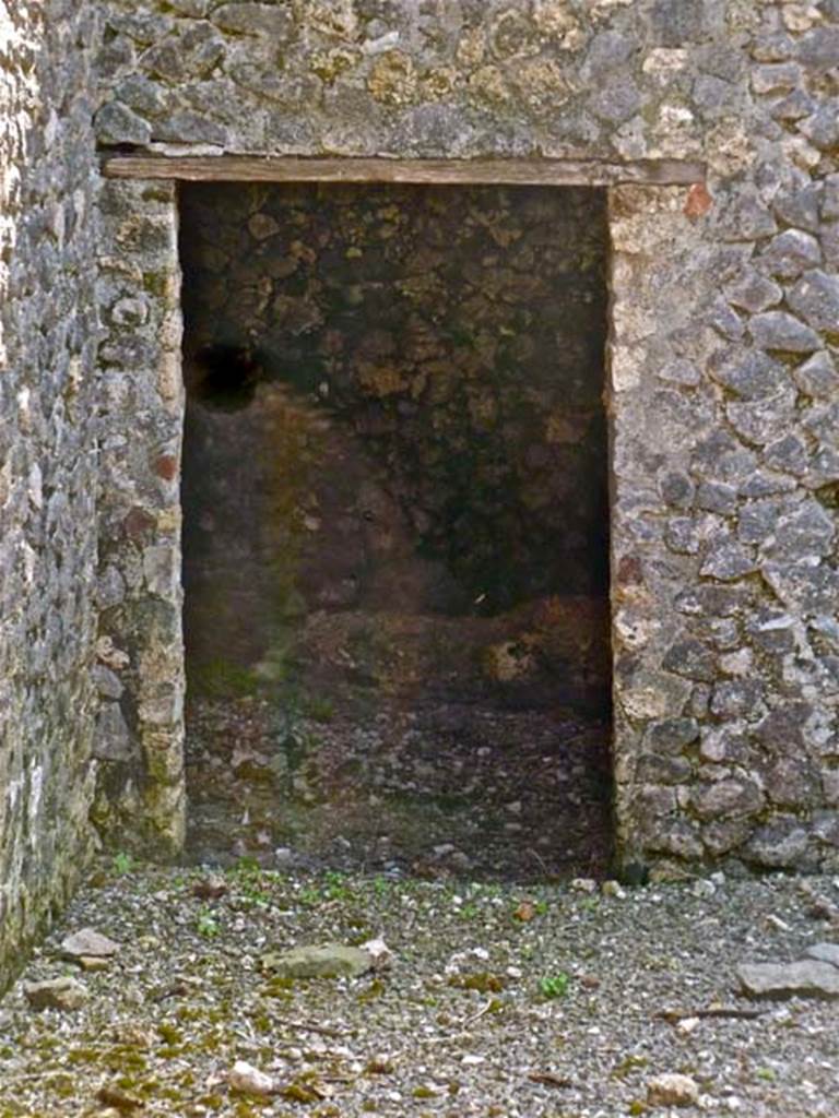 VI.17.37 Pompeii. May 2011. Doorway in west wall at lower level. Photo courtesy of Michael Binns.