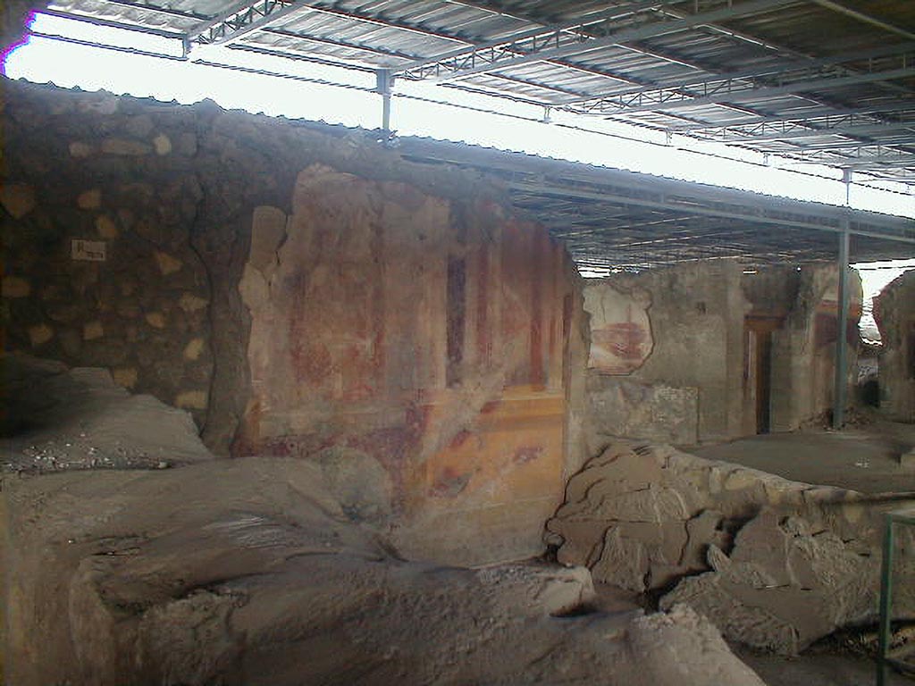 VI.17.41 Pompeii. September 2004. 
Looking north-west towards west wall of triclinium with painted decoration, on south side of atrium.