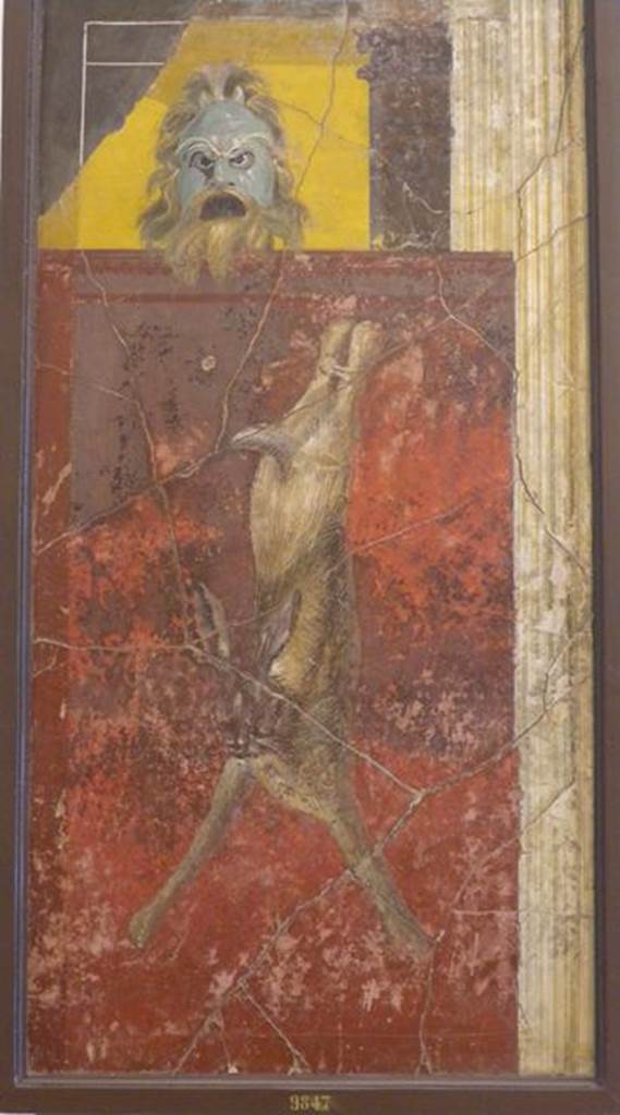VI.17.41 Pompeii. Found on 27th October 1759 in cubiculum 17 on the north wall.  Wall painting of mask, columns with hanging hare. Now in Naples Archaeological Museum. Inventory number 9847. See Pagano, M. and Prisciandaro, R., 2006. Studio sulle provenienze degli oggetti rinvenuti negli scavi borbonici del regno di Napoli.  Naples : Nicola Longobardi. (p.31-2).
