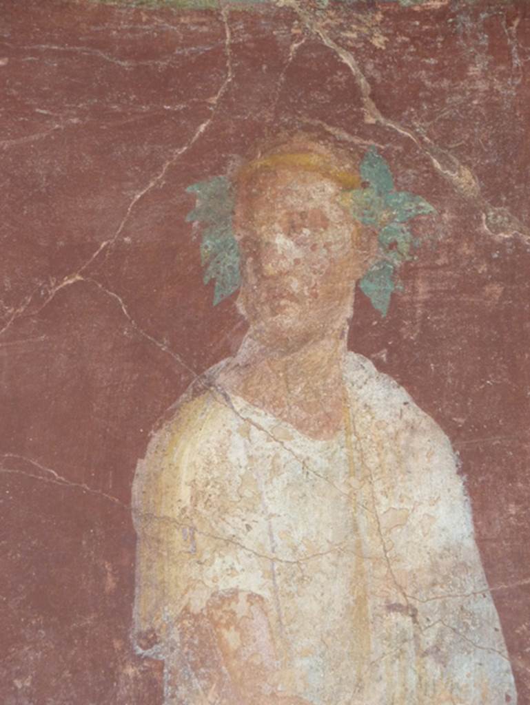 VI.17.41 Pompeii. October 2010. East wall of exedra 18 on north side of cubiculum 17. 
Detail of painting of robed figure. Photo courtesy of Gaby Große.