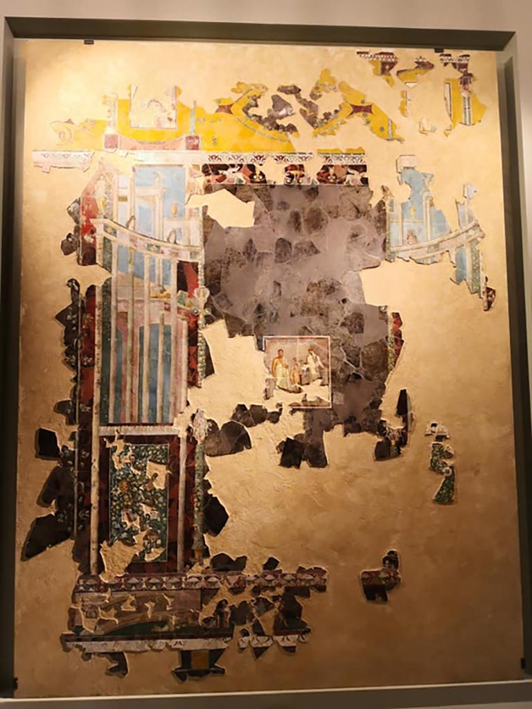 VI.17.42 Pompeii. 2019. 
Recomposed fresco of architectural view and central painting of the poet Euphorion (c.30-35AD).
On display in exhibition “Pompei e Santorini” in Rome, 2019. Photo courtesy of Giuseppe Ciaramella.