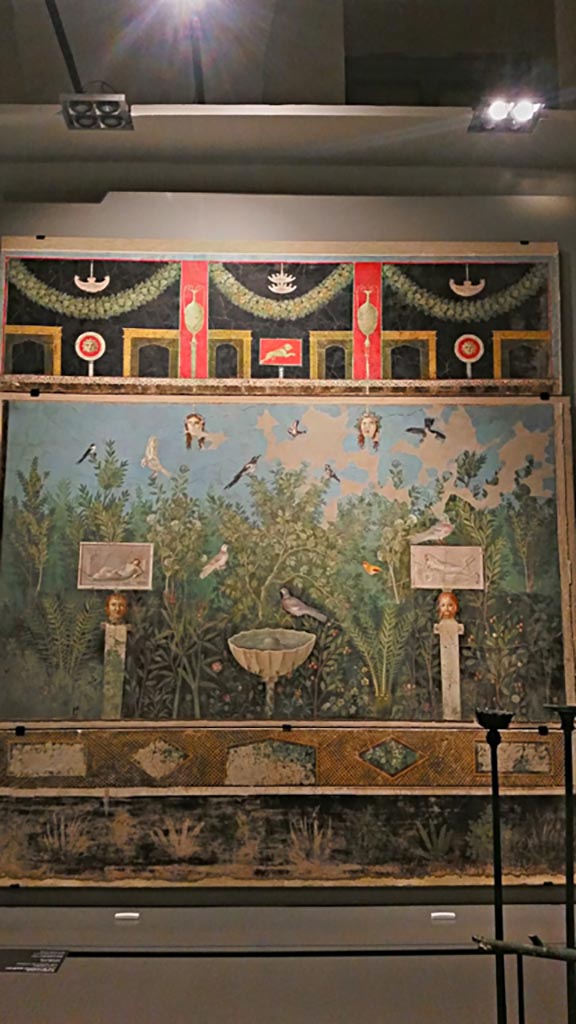 VI.17.42 Pompeii. December 2019. 
Oecus 32, looking toward painted north wall from large reception room decorated with luxurious garden.
On display in exhibition “Pompei e Santorini” in Rome, 2019. Photo courtesy of Giuseppe Ciaramella.