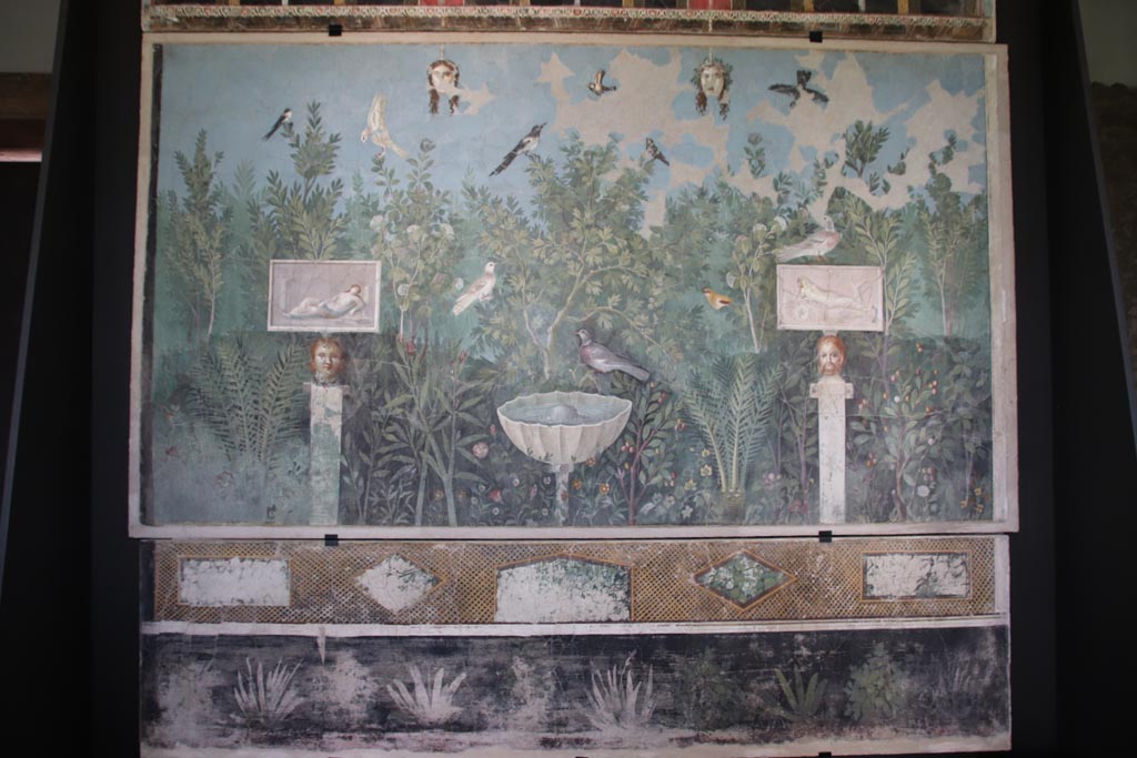 VI.17.42 Pompeii. October 2022. 
Oecus 32, painted north wall from large reception room decorated with luxurious garden. On display in exhibition in Palaestra. 
Photo courtesy of Klaus Heese.