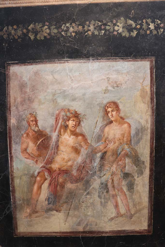 VI.17.42 Pompeii. February 2021. 
Fresco showing Dionysus and Ariadne in Naxos, found on the triclinium north wall, on display in Antiquarium at VIII.1.4.
Photo courtesy of Fabien Bièvre-Perrin (CC BY-NC-SA).
Kuivalainen describes –
“A composition of three figures on the shore of a rocky landscape. ……………..”
Kuivalainen comments –
“Instead of portraying Bacchus just discovering Ariadne, the situation here has already developed. He is drunk and making a pass at her. She is standing wide awake, looks a little surprised by the encounter with a tipsy looking stranger, and makes efforts to protect her modesty. The horizontal line is very high.”
See Kuivalainen, I., 2021. The Portrayal of Pompeian Bacchus. Commentationes Humanarum Litterarum 140. Helsinki: Finnish Society of Sciences and Letters, (p.156, E20).