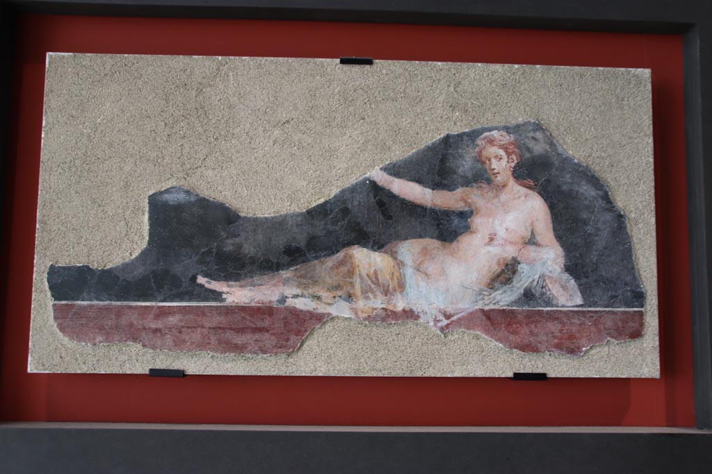 VI.17.42 Pompeii, October 2022. 
Painting of a half-naked Maenad lying down, on display in exhibition in Palaestra. Photo courtesy of Klaus Heese.
