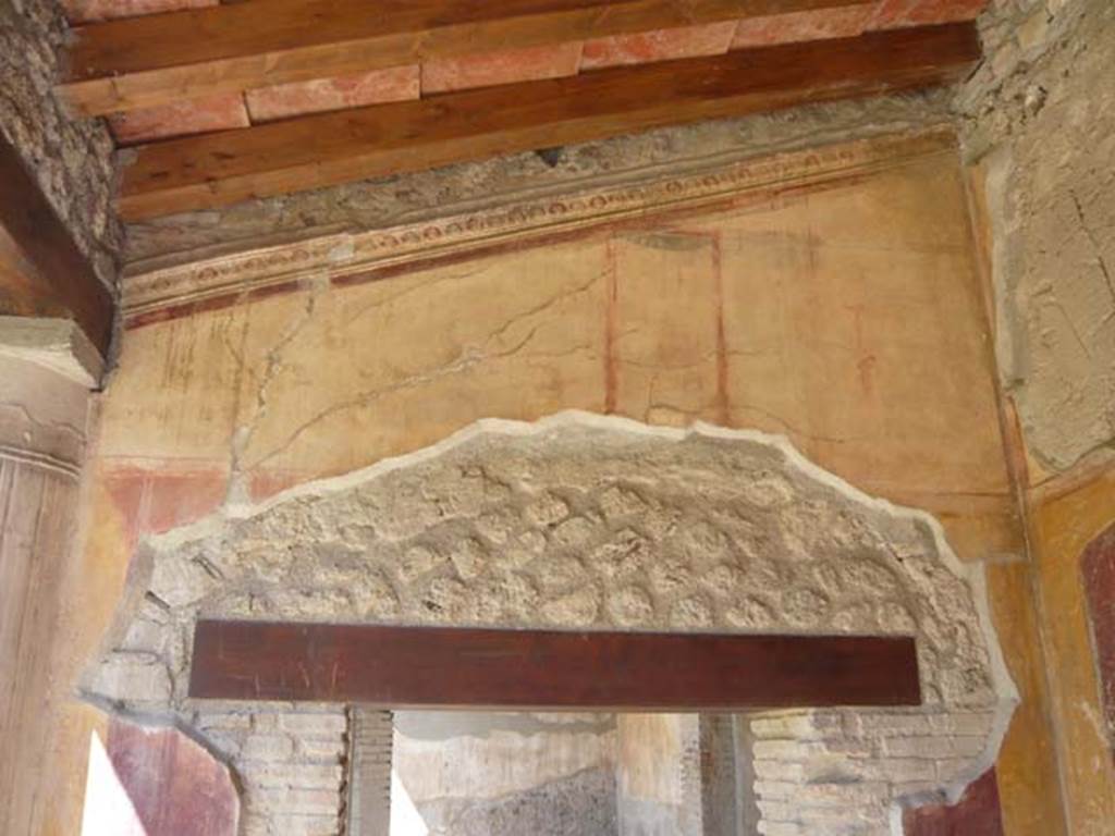 VII.1.8 Pompeii. May 2012. Looking towards upper west wall on north portico B, above doorway to room Q.. Photo courtesy of Buzz Ferebee.