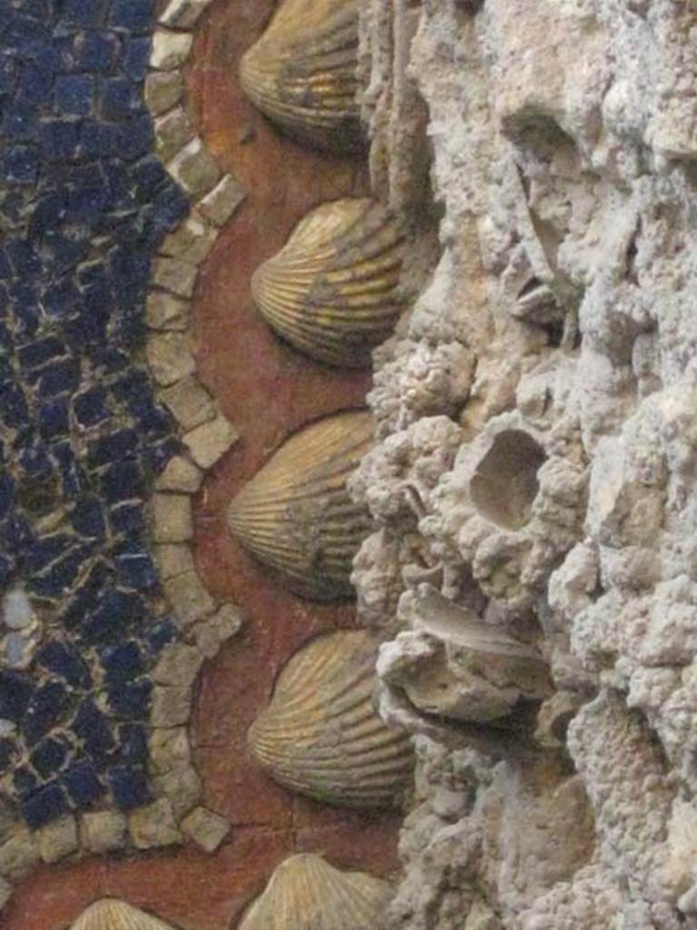 VII.1.8 Pompeii. July 2012. Nymphaeum G, west wall, mosaics and shells at top of niche. Photo courtesy of Sharon M. Wolf.