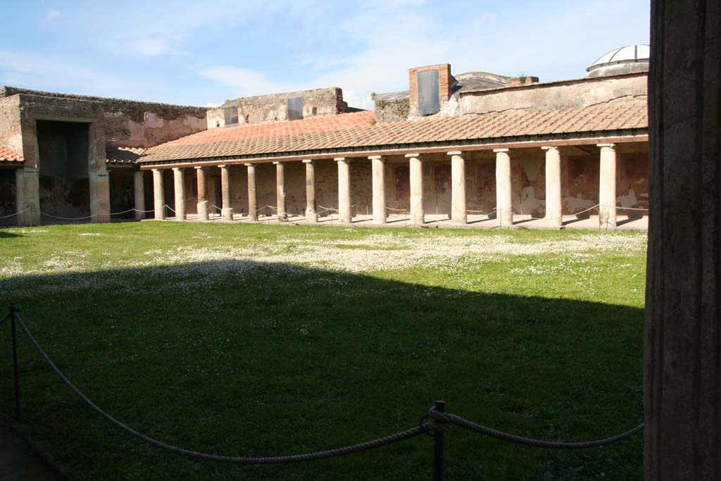 VII.1.8 Pompeii. April 2013. Looking north-east across gymnasium C towards east portico. 
Photo courtesy of Klaus Heese.
