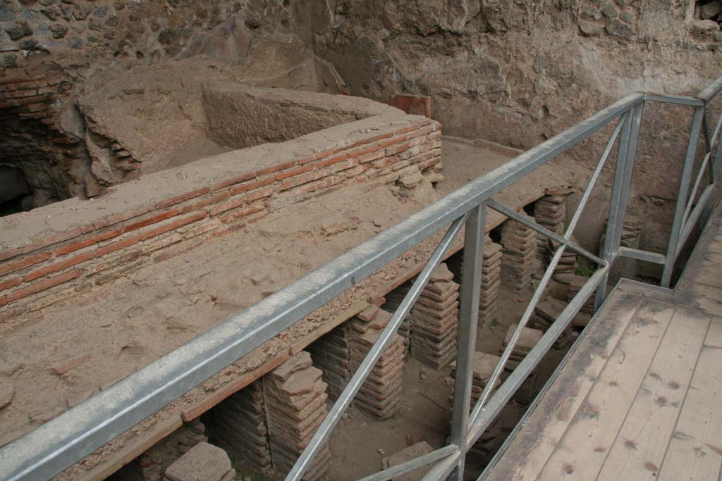 VII.1.8 Pompeii. April 2013. Men’s tepidarium 3, looking towards south-east corner, and detail of hypocaust system. 
Photo courtesy of Klaus Heese.