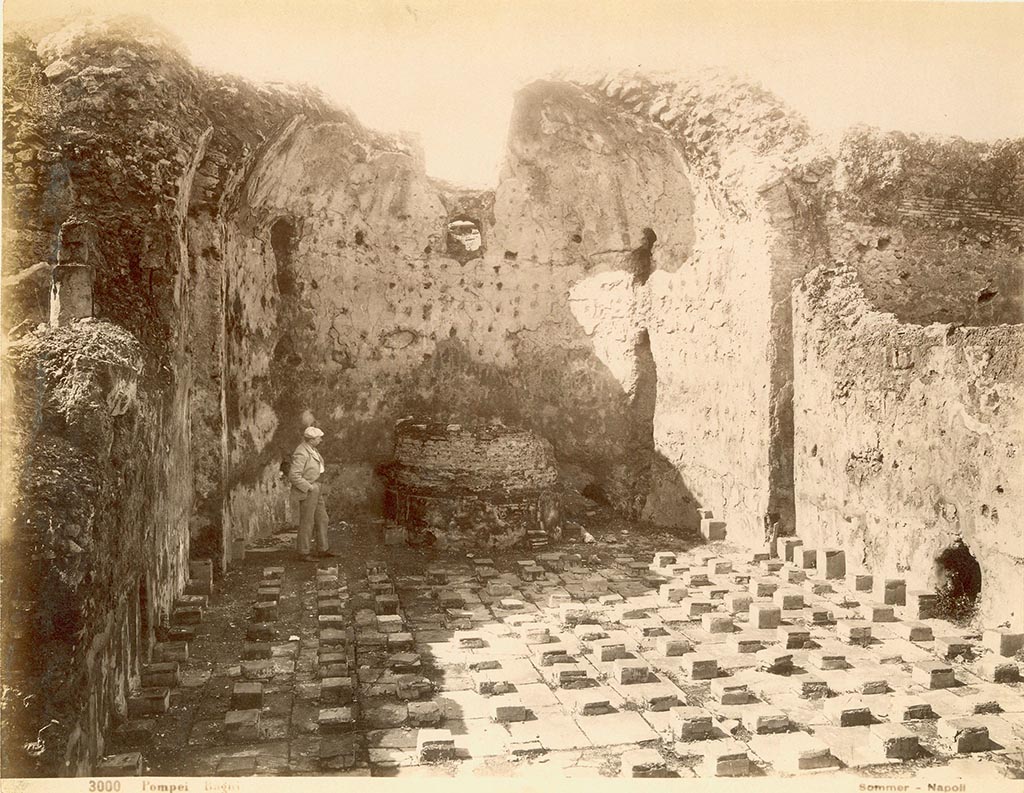 VII.1.8 Pompeii. Old 19th century photograph by Giorgio Sommer. 
Looking west in men’s calidarium 5 with remains of support for marble drinking water basin. 
The skylight in the apse also helped to regulate the temperature.