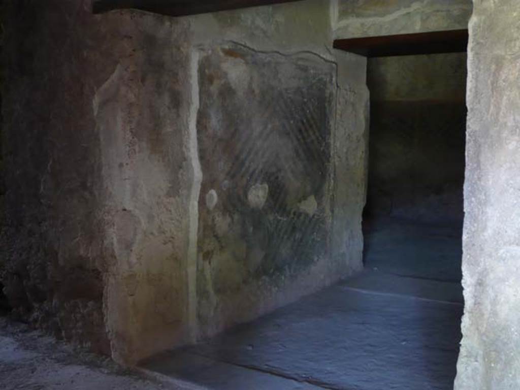 VII.1.8 Pompeii. May 2012. Detail of west wall at entrance to latrine O. Photo courtesy of Buzz Ferebee.