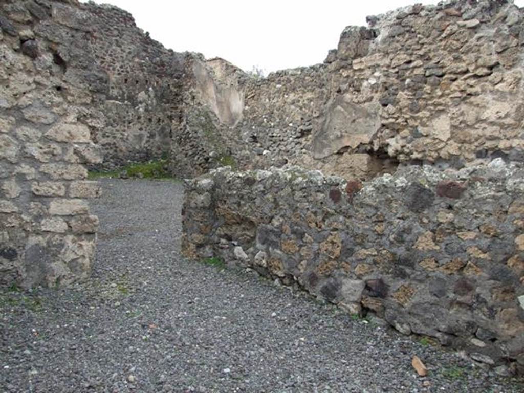 VII.1.21 Pompeii. December 2007.  North wall of shop with entrance to atrium of VII.1.22 in north-west corner.