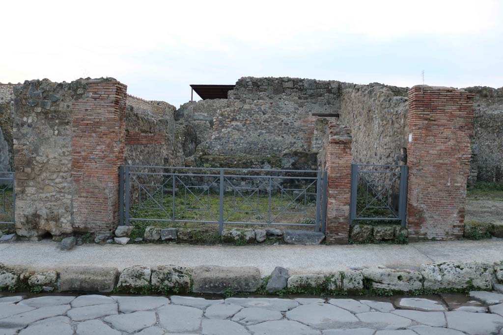 VII.1.28 Pompeii, centre left. December 2018. 
Looking west to entrance doorway, including steps to upper floor at VII.1.29, on right of it. Photo courtesy of Aude Durand.