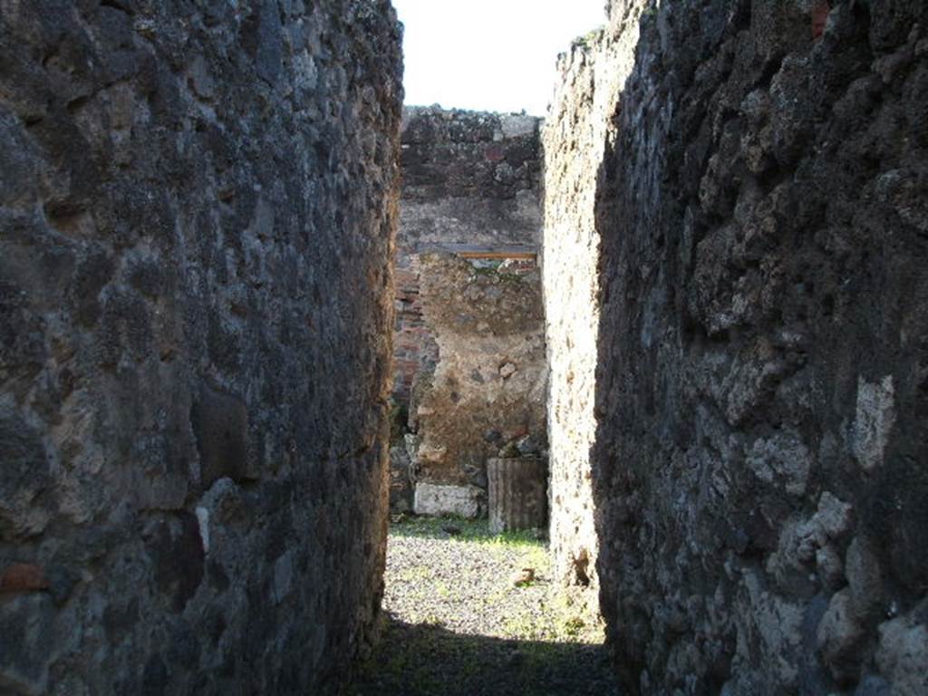 VII.1.30 Pompeii. December 2004.  Looking west along long entrance corridor. According to Fiorelli, a corridor led from the street to a stable, which was partly covered with a roof, and had a long podium for use as a manger.