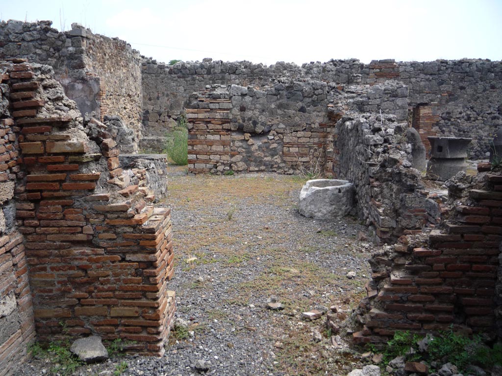 VII.1.36 Pompeii. October 2009. 
Looking east to doorway to atrium from room in south-west corner of atrium. Photo courtesy of Jared Benton.