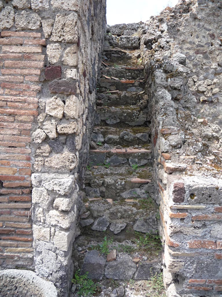 VII.1.36 Pompeii. October 2009. 
Looking west to steps on north side of oven. Photo courtesy of Jared Benton.