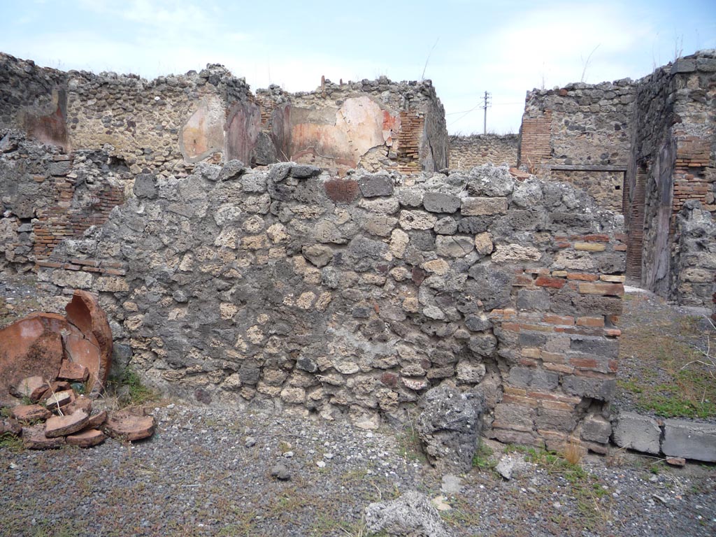 VII.1.36 Pompeii. October 2009. 
Looking north to south wall of atrium, with doorway to south-east corner, on right. Photo courtesy of Jared Benton.