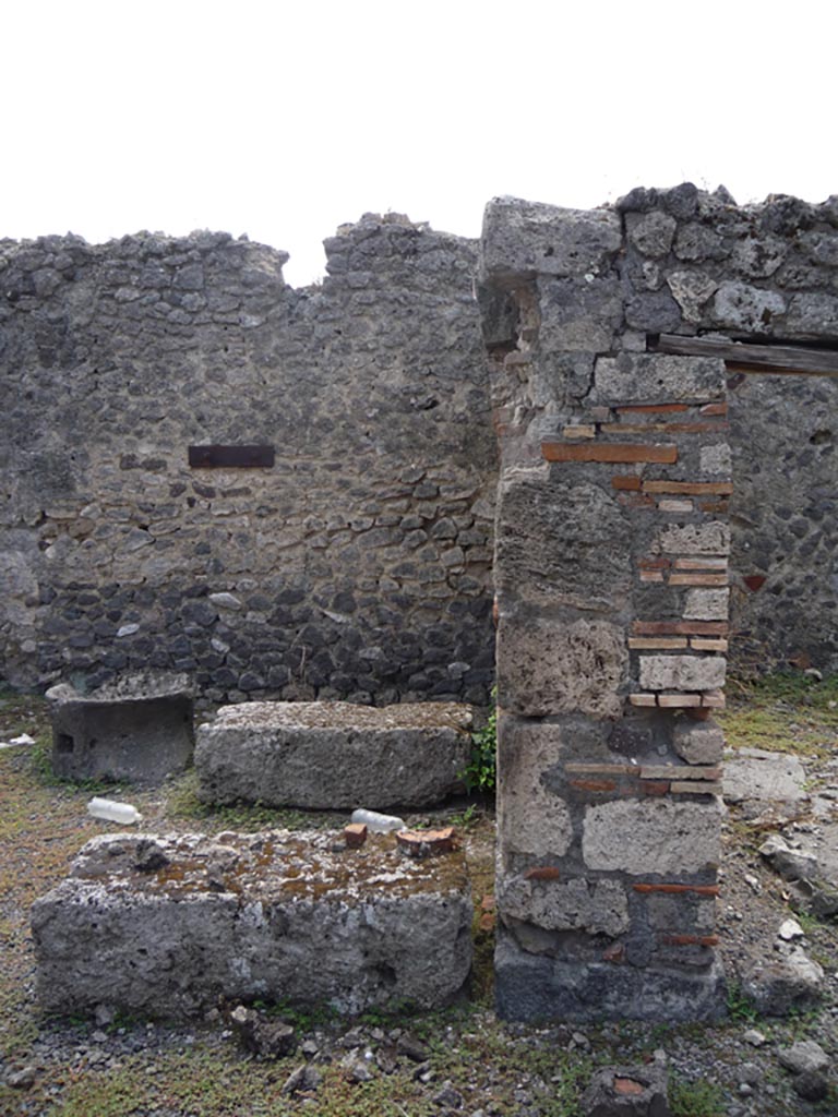 VII.1.36 Pompeii. October 2009. 
Looking south towards pilaster dividing two rooms on south side of oven. Photo courtesy of Jared Benton.