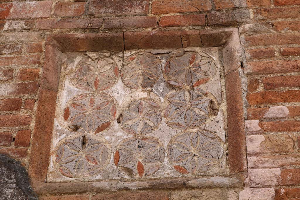 VII.1.36 Pompeii. December 2018. Detail of geometric plaque. Photo courtesy of Aude Durand.