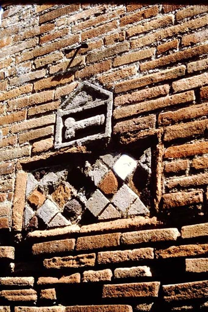 VII.1.36 Pompeii. 1964.  Plaques on west side of entrance doorway. Photo by Stanley A. Jashemski.
Source: The Wilhelmina and Stanley A. Jashemski archive in the University of Maryland Library, Special Collections (See collection page) and made available under the Creative Commons Attribution-Non Commercial License v.4. See Licence and use details.
J64f1314