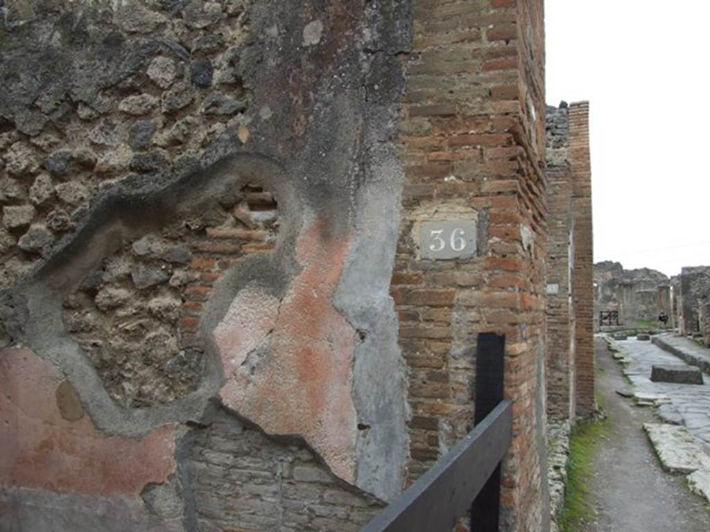 VII.1.36 Pompeii. December 2007. West side of entrance fauces and looking west along Via degli Augustali.