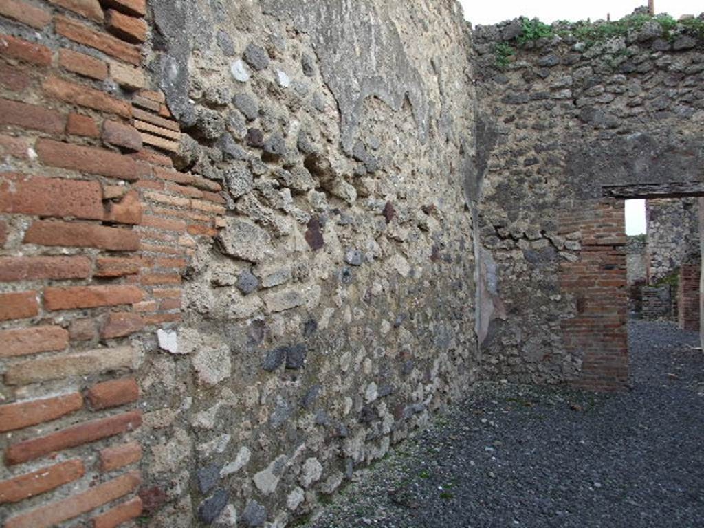 VII.1.37 Pompeii. December 2006. Looking south along east wall of shop.