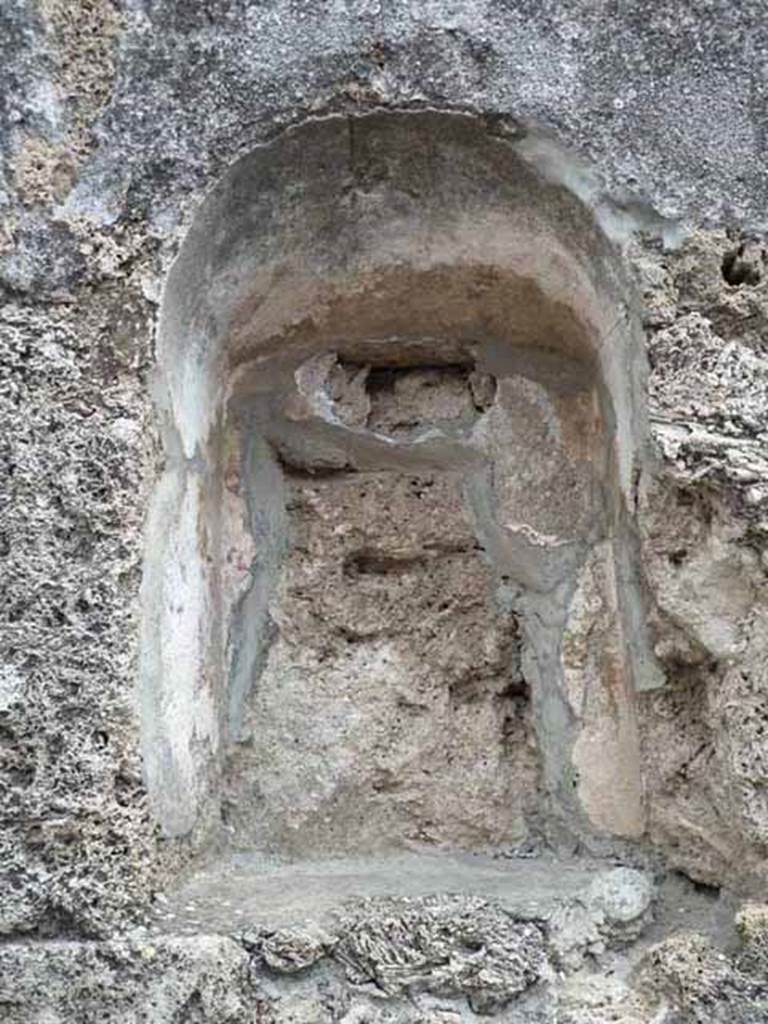 VII.1.42 Pompeii. May 2010. Niche, with remains of painting.
According to Frohlich, on the left was a Lar, in the middle was a round altar, and many figures in a group, possibly the vicomagistri.
See Fröhlich, T., 1991. Lararien und Fassadenbilder in den Vesuvstädten. Mainz: von Zabern. (F44, p.324)
See Pappalardo, U., 2001. La Descrizione di Pompei per Giuseppe Fiorelli (1875). Napoli: Massa Editore. (p. 78)